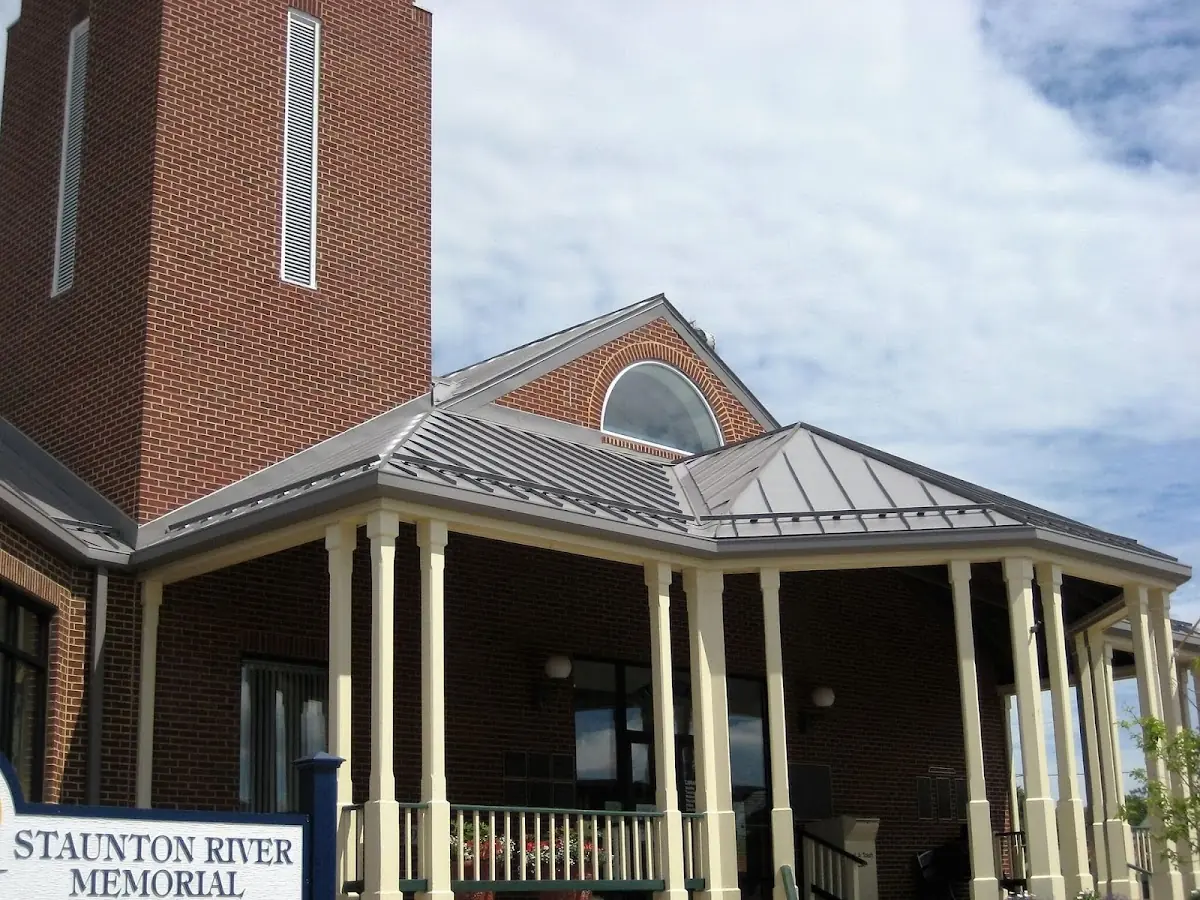 Skilled roofing craftsmen working on a residential roof in Claysburg